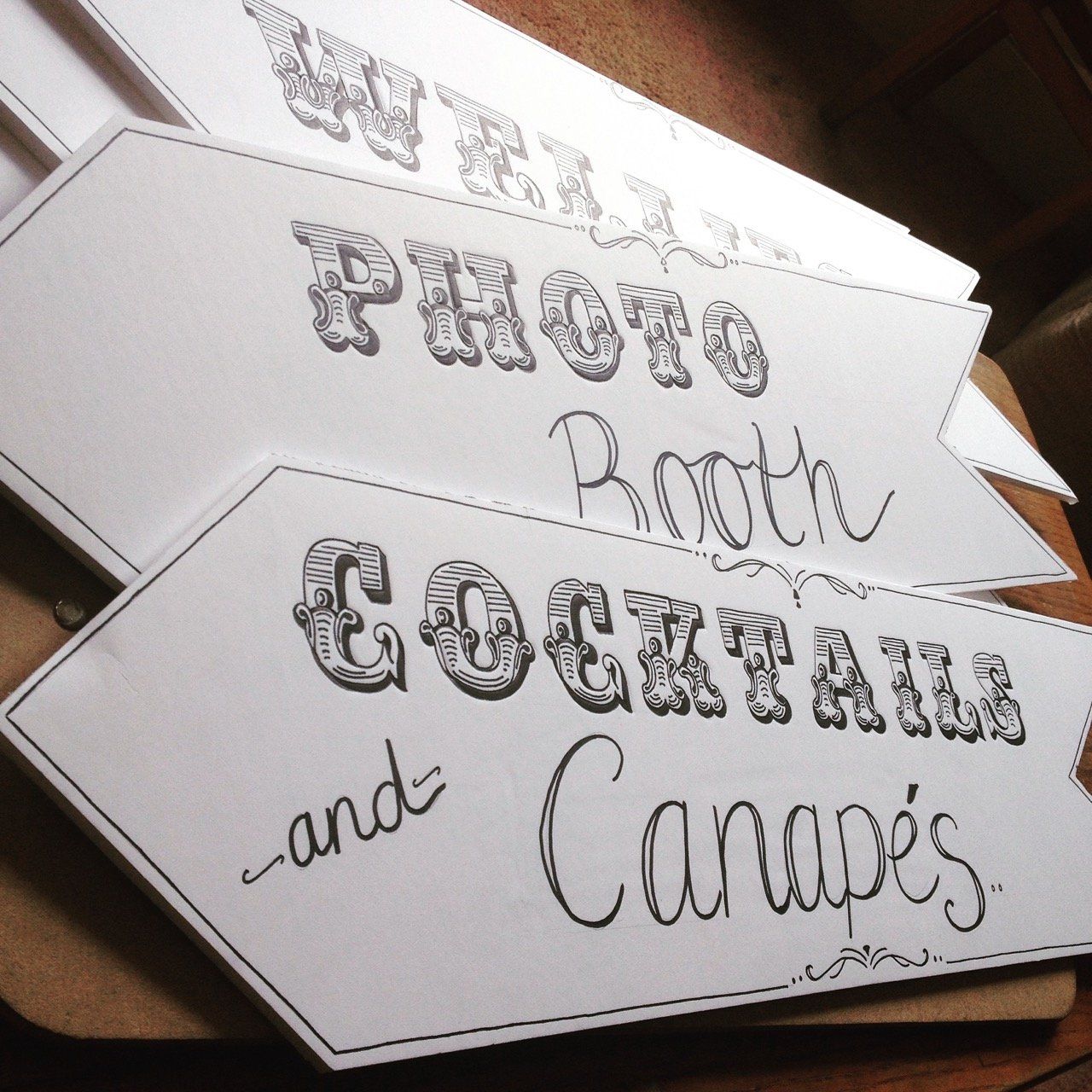 A sign that says photo booth cocktails and canapés