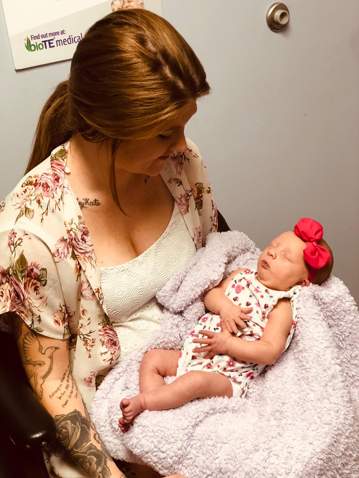 Baby Girl with Pink Ribbon — Ocala, FL — All About Women OB/GYN Clinic