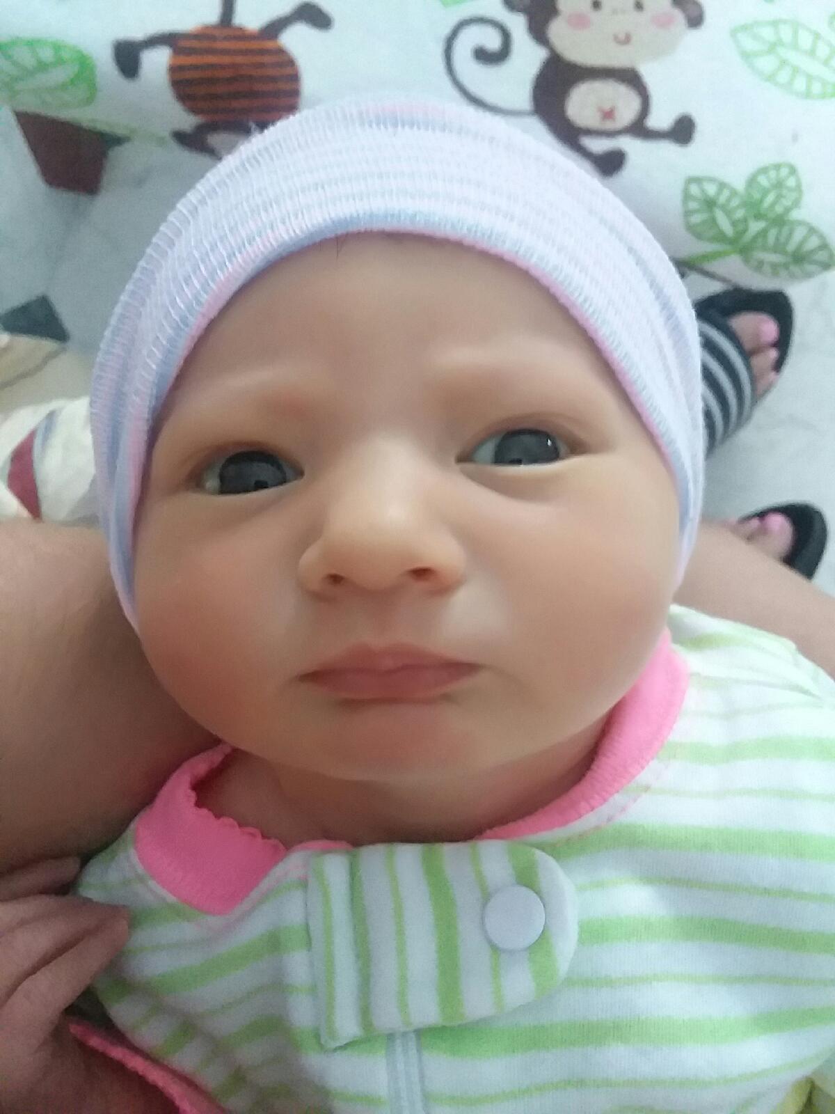 Baby Wearing Green Stripes Romper — Ocala, FL — All About Women OB/GYN Clinic