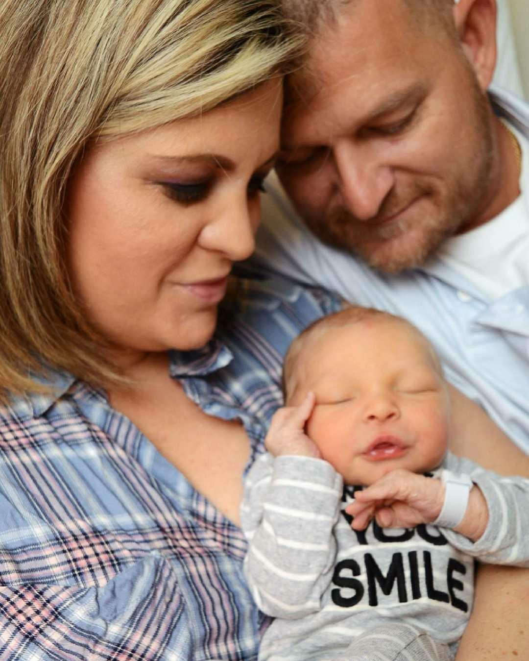 Couple with Sleeping Baby — Ocala, FL — All About Women OB/GYN Clinic