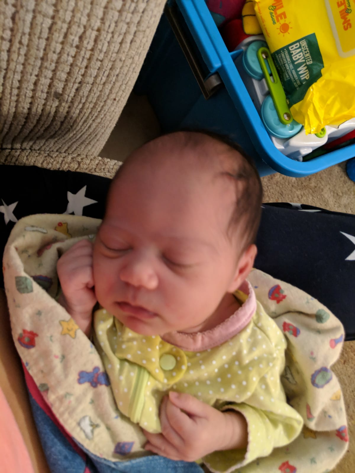 Baby Wearing Yellow Romper — Ocala, FL — All About Women OB/GYN Clinic