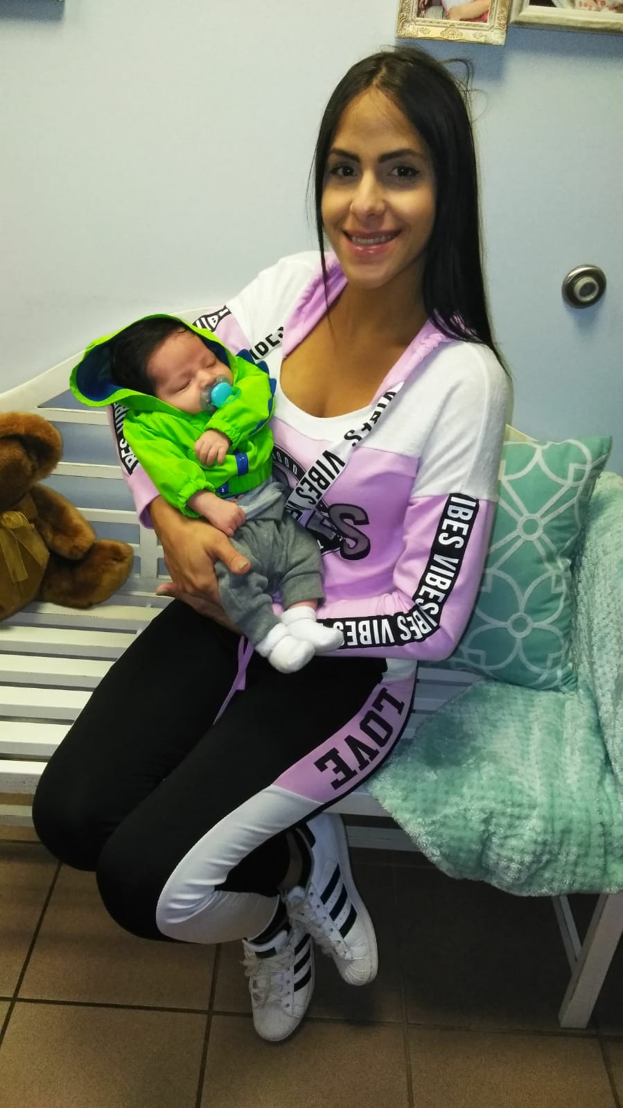 Baby Wearing Green Jacket — Ocala, FL — All About Women OB/GYN Clinic