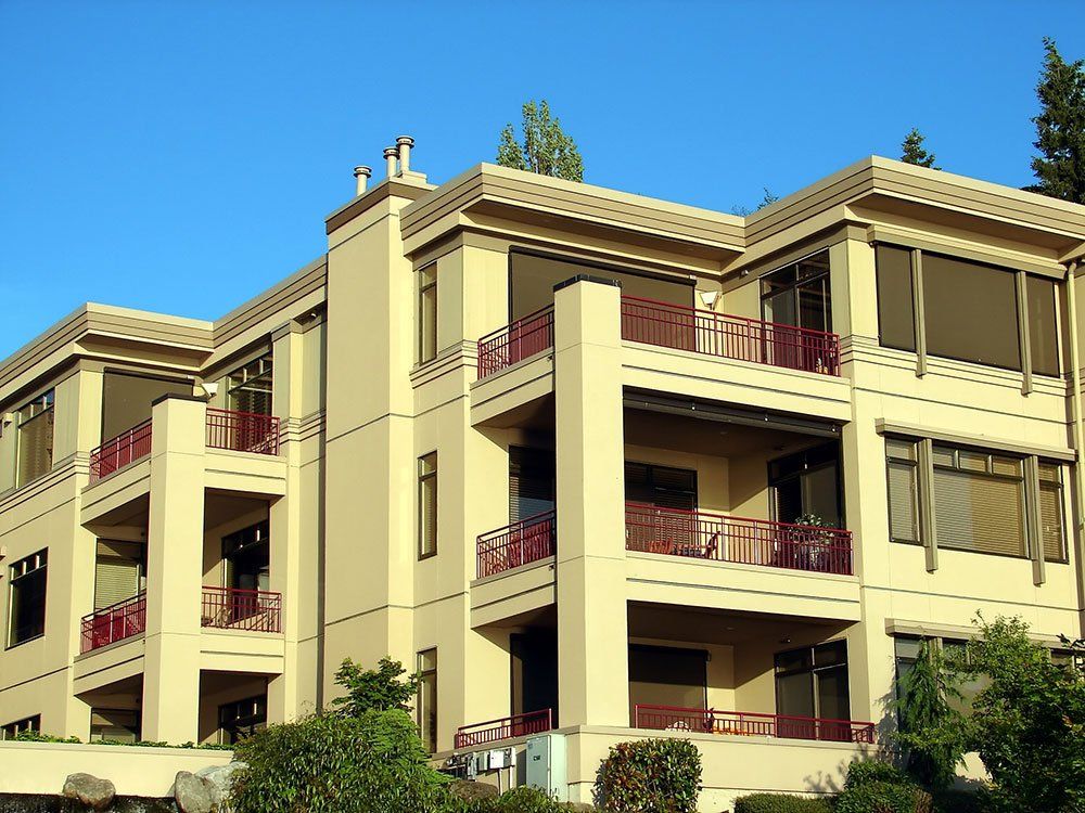 A large building with a lot of windows and balconies