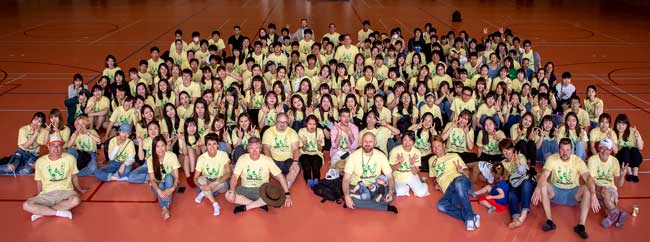 A large group of people wearing yellow Walkathon shirts