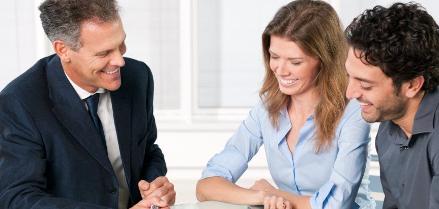 people signing documents