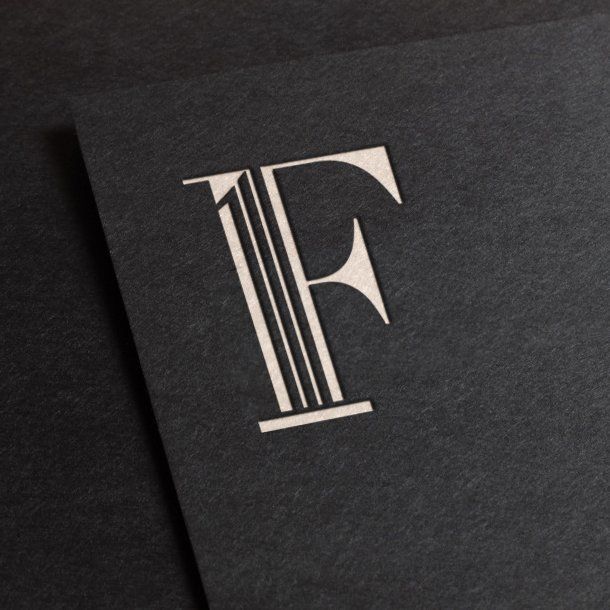 Black card with a white stylized capital “F” logo in the center