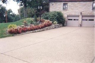 Amazing stone house with column porch and two car garage—Custom Concrete & Concrete Services in Glenshaw, Pennsylvania Amazing stone house with column porch and two car garage—Custom Concrete & Concrete Services in Glenshaw, Pennsylvania