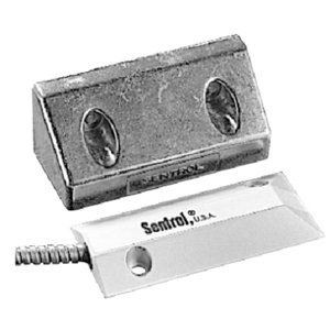 A Sentrol door/window contact sensor with a metal housing and a magnetic switch.