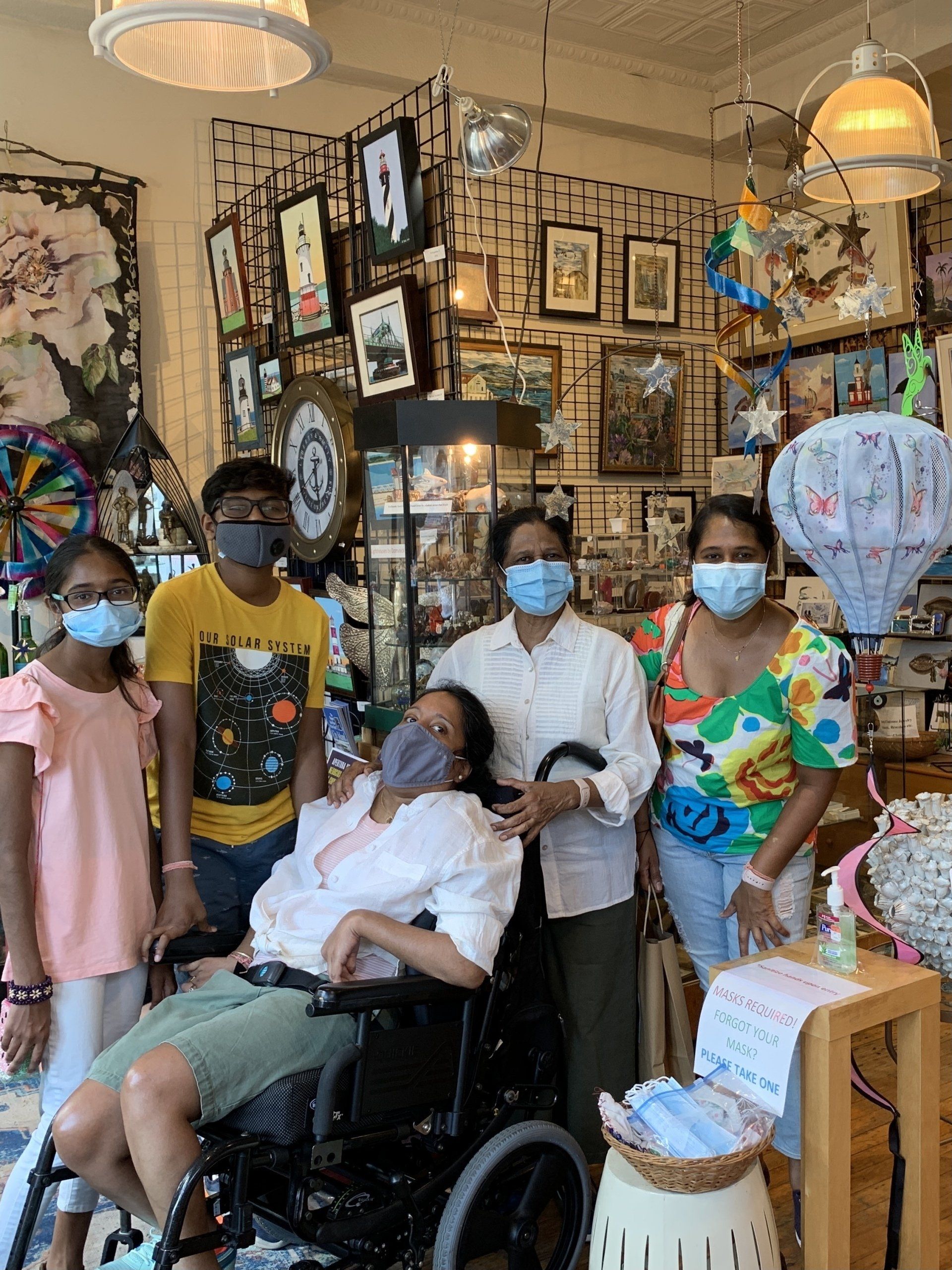 Our family surrounded by many arts, crafts and antique items in the store at City Island.