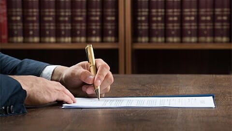 Lawyer Signing In A Legal Paper — Attorney in Columbus, OH Lawyer Signing In A Legal Paper — Attorney in Columbus, OH