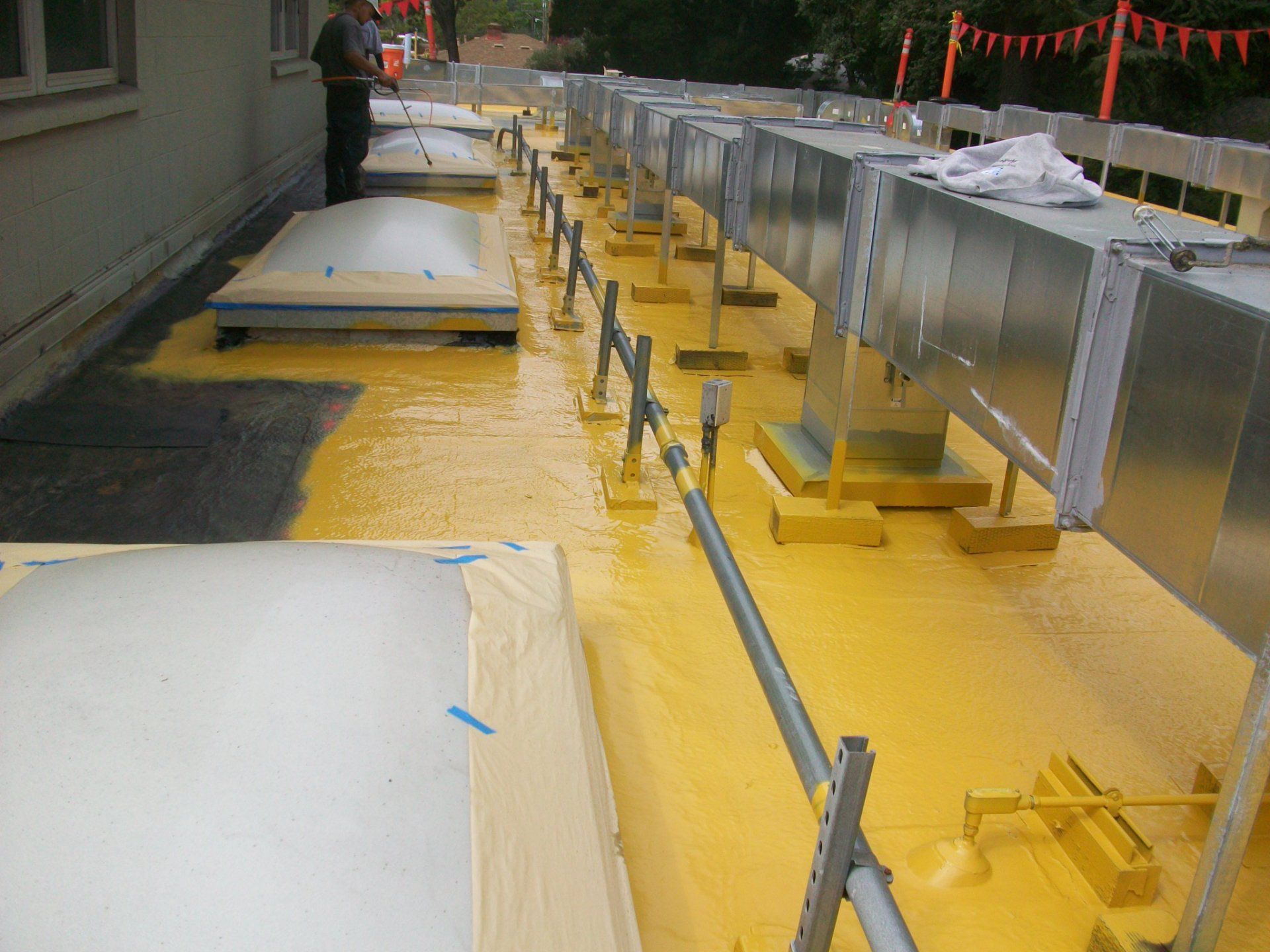 Combined fluid applied membrane (non breathable) with liquid applied roof coating.
