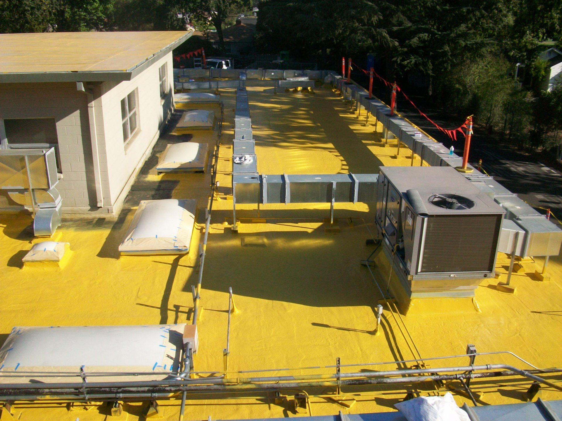 Combined fluid applied membrane (non breathable) with liquid applied roof coating.