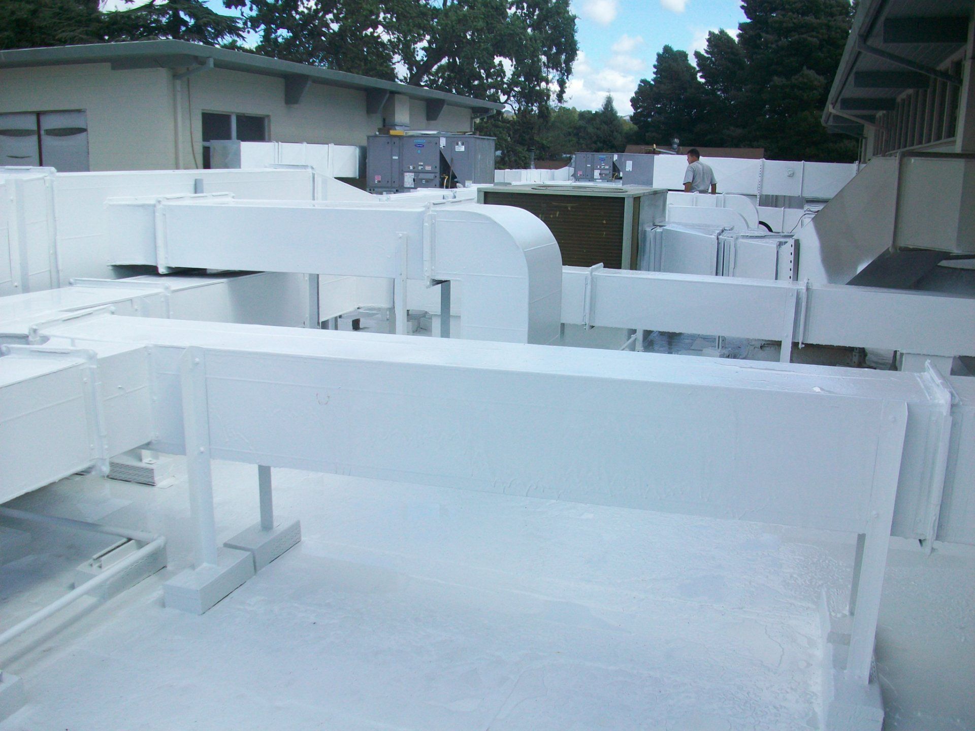 Combined fluid applied membrane (non breathable) with liquid applied roof coating.