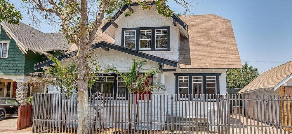 Exterior of Residence at 23rd Street - White, two-story home with black trim