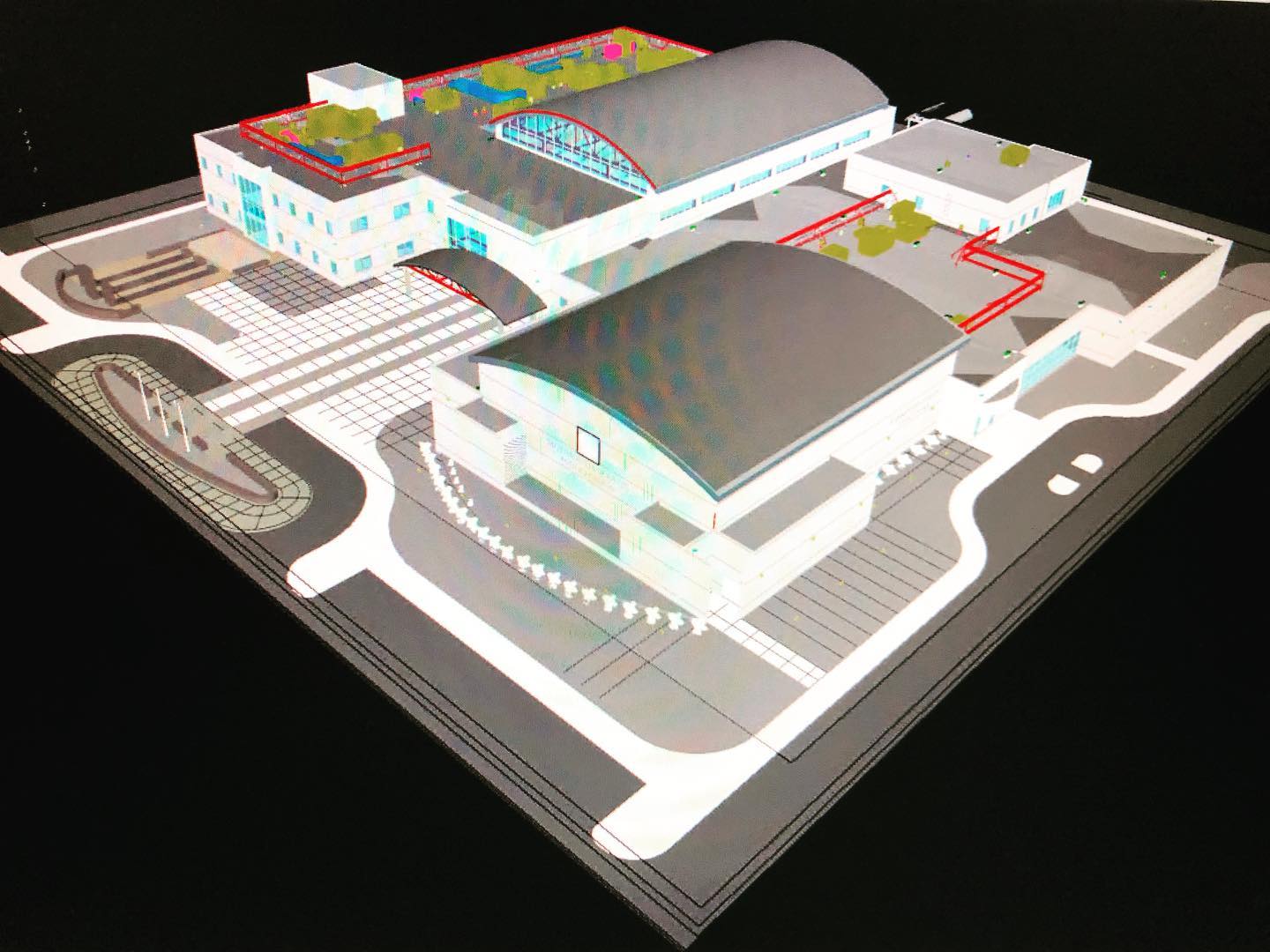 a model of a building with a roof that has a green roof .
