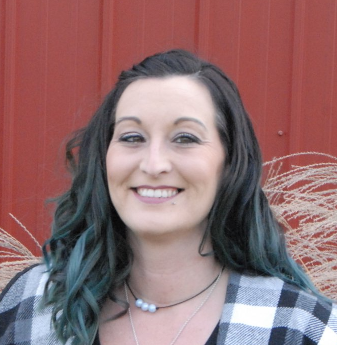 alli in front of a barn