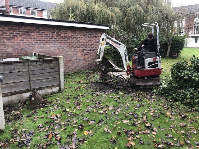 Work begins on a new patio with new fencing in Alderley Edge