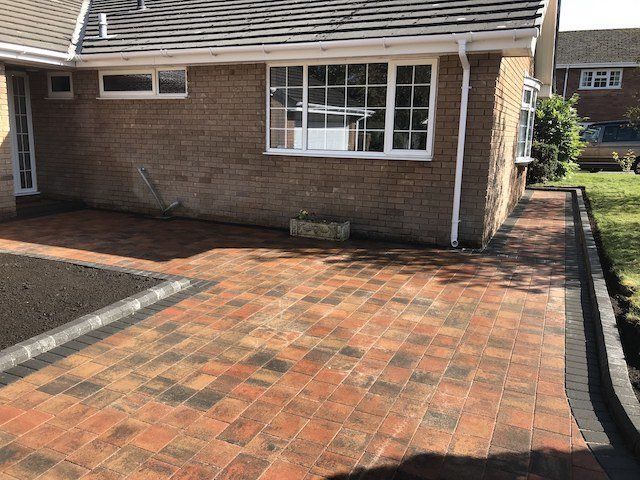 Finished in Tobermore Shannon Heather Main with Charcoal Pedesta border and KS Key Kerbs in Charcoal, the completed driveway in Cuddington, Cheshire.
