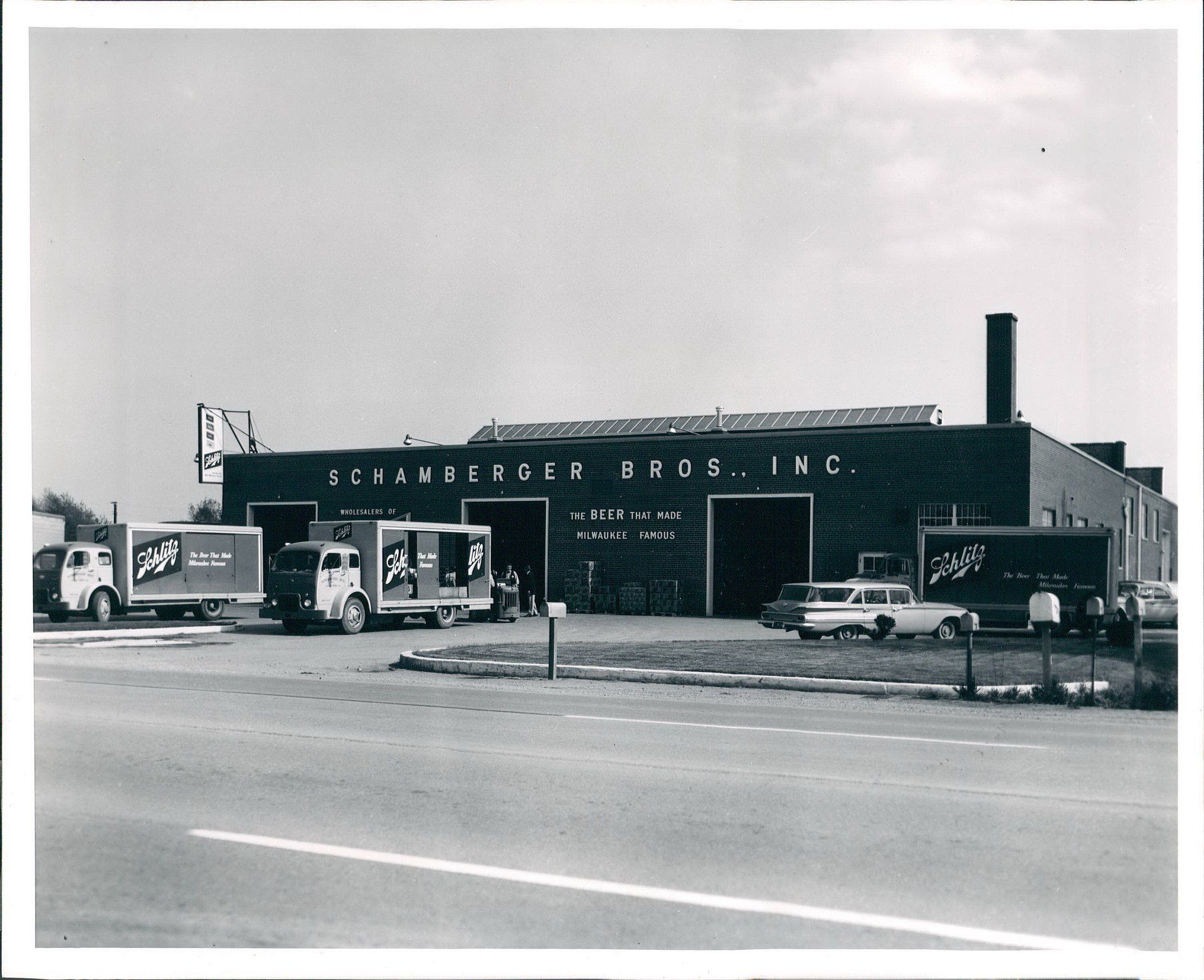 A black and white photo of a schauberger bros. inc. building