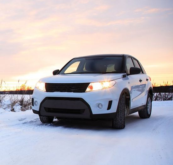 Modern Car with Glowing Headlights — Colorado Springs, CO — A Action Services, LLC.