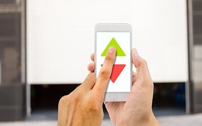 MyQ Garage Door App — Man Using Smartphone to Open and Close the Garage in Converse,TX