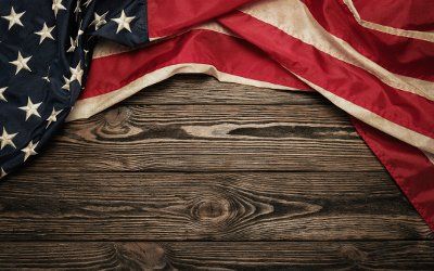 American flag with wooden background - Garage Door Solutions