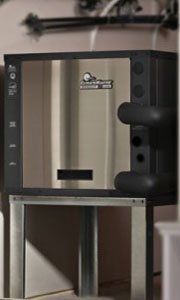 A stainless steel box on a stand that says ' stainless steel ' on it
