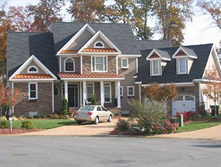 Cutting Shingle — Roofing Service in Hampton, VA Cutting Shingle — Roofing Service in Hampton, VA