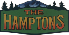 A green sign that says the hamptons on it
