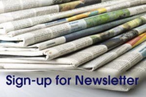 A stack of newspapers with the text