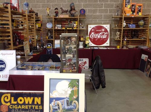 A clown cigarettes sign is on a table in a room
