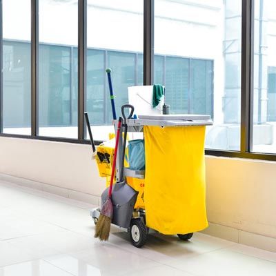 Cleaning tools cart wait for cleaning,Yellow mop bucket and set of cleaning equipment in the airport
