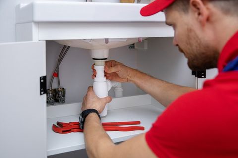 Plumber Plumber Installing Sink Siphon — Quakertown, PA — Lou The Plumber LLC