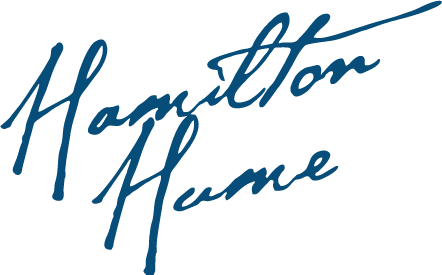 Blue handwritten logo reading “Hamilton Hume” on a white background