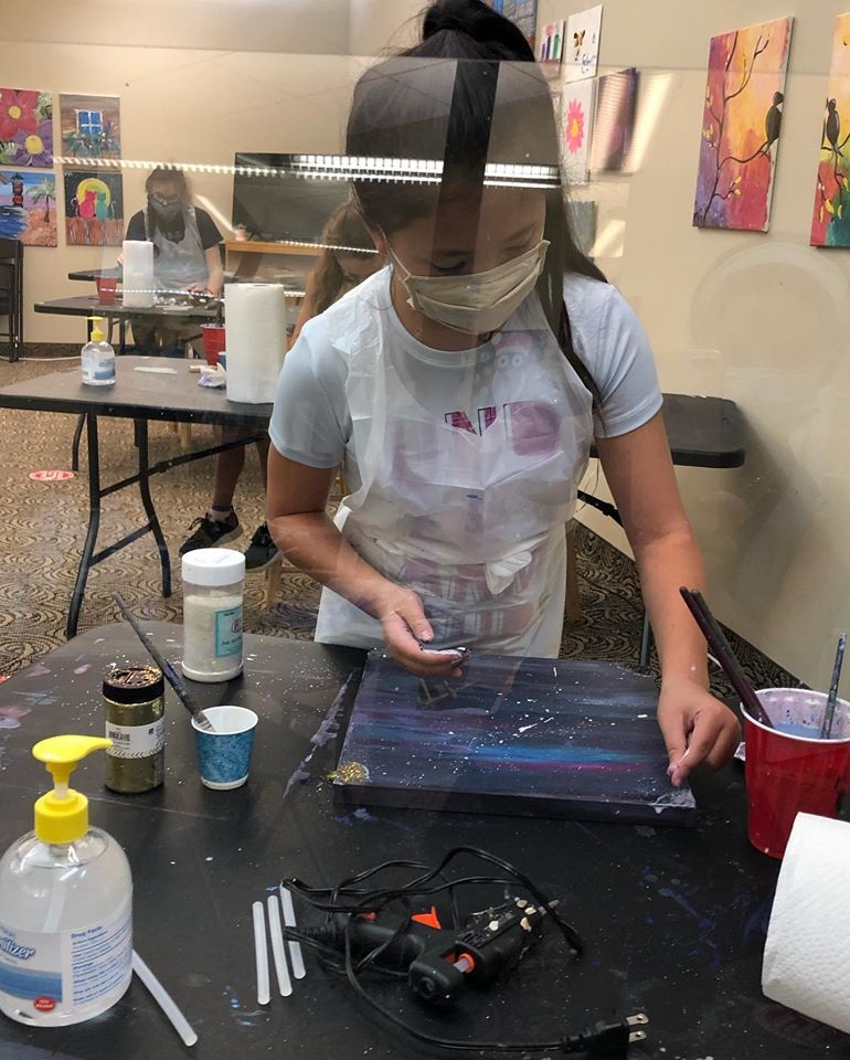 kid in studio painting