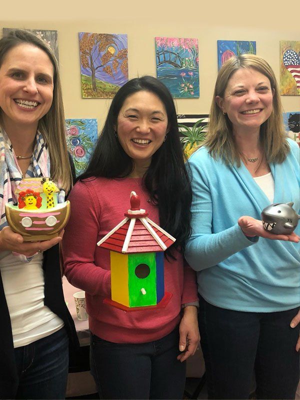 3 women with woodwork