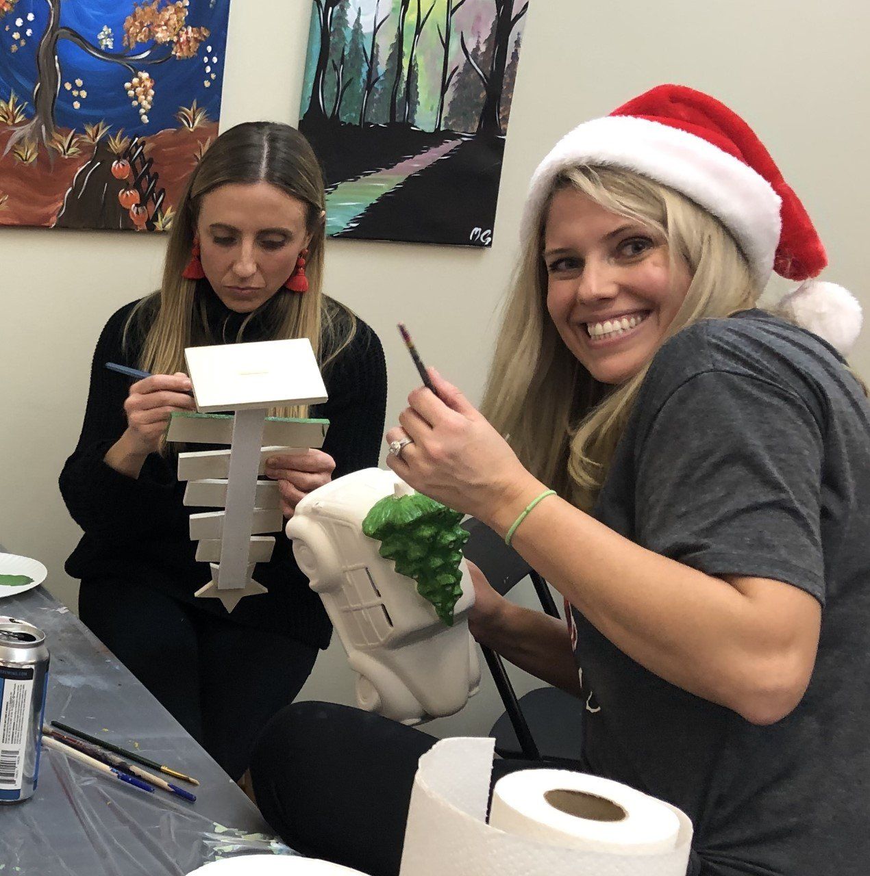 Friends painting ceramic pieces
