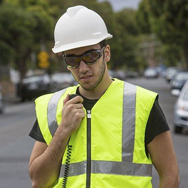 working holding a board with multiple sign boards mildura traffic management working holding a board with multiple sign boards