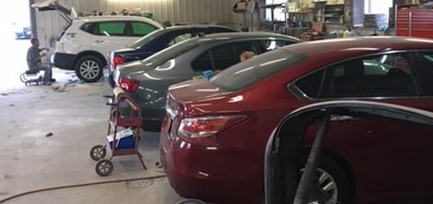 Cars in garage — Auto Body Services in Oneida, NY Cars in garage — Auto Body Services in Oneida, NY