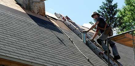 A man providing Roofing Repair in Huntington Beach, CA