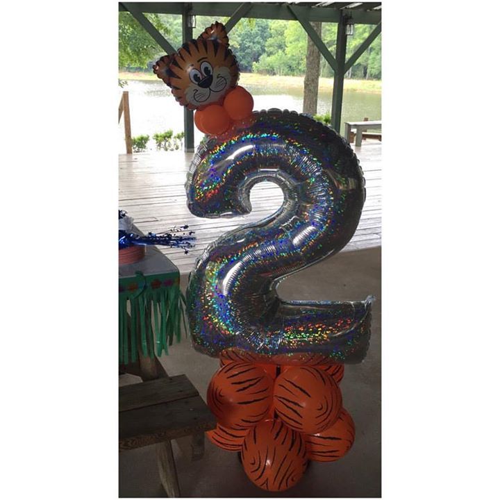 A tiger themed balloon decoration with a number 2.