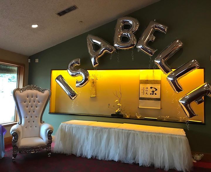 A silver balloon letter archway (for Isabelle).