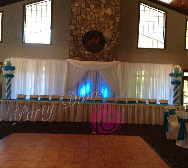Custom draping for a head table at an event.