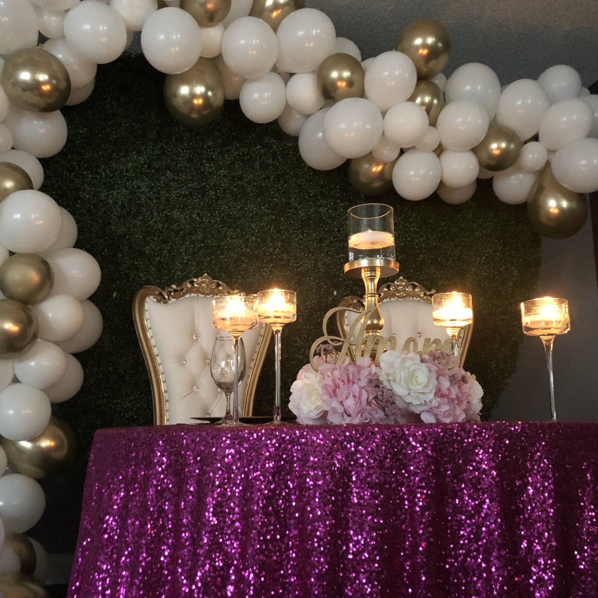 An elegant white and gold balloon garland.