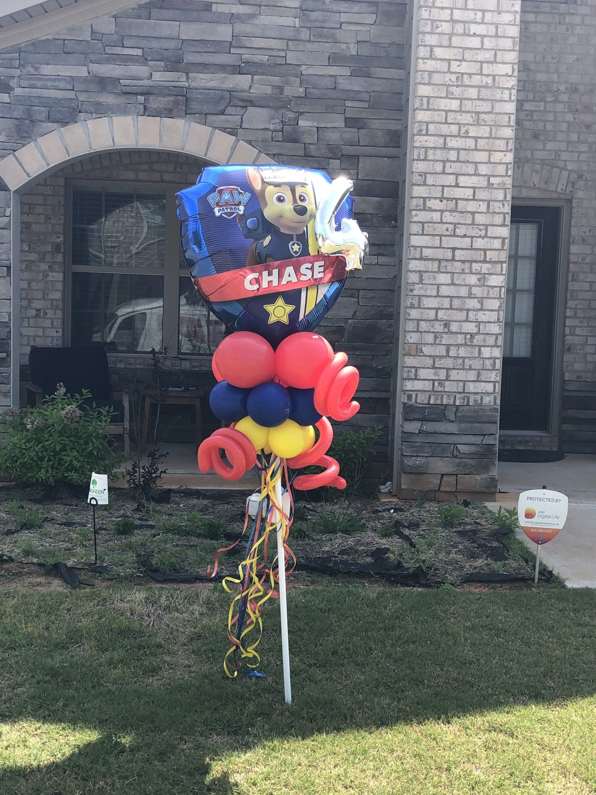 Paw Patrol Chase character balloon with red and blue balloon base for kids birthday yard decor