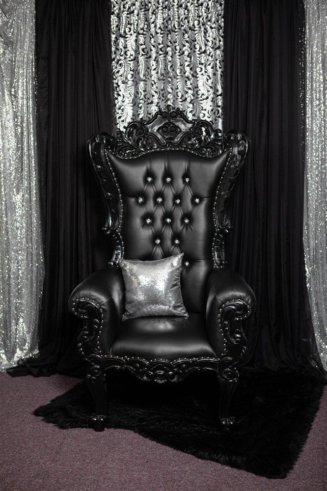 A petite throne with gold trim