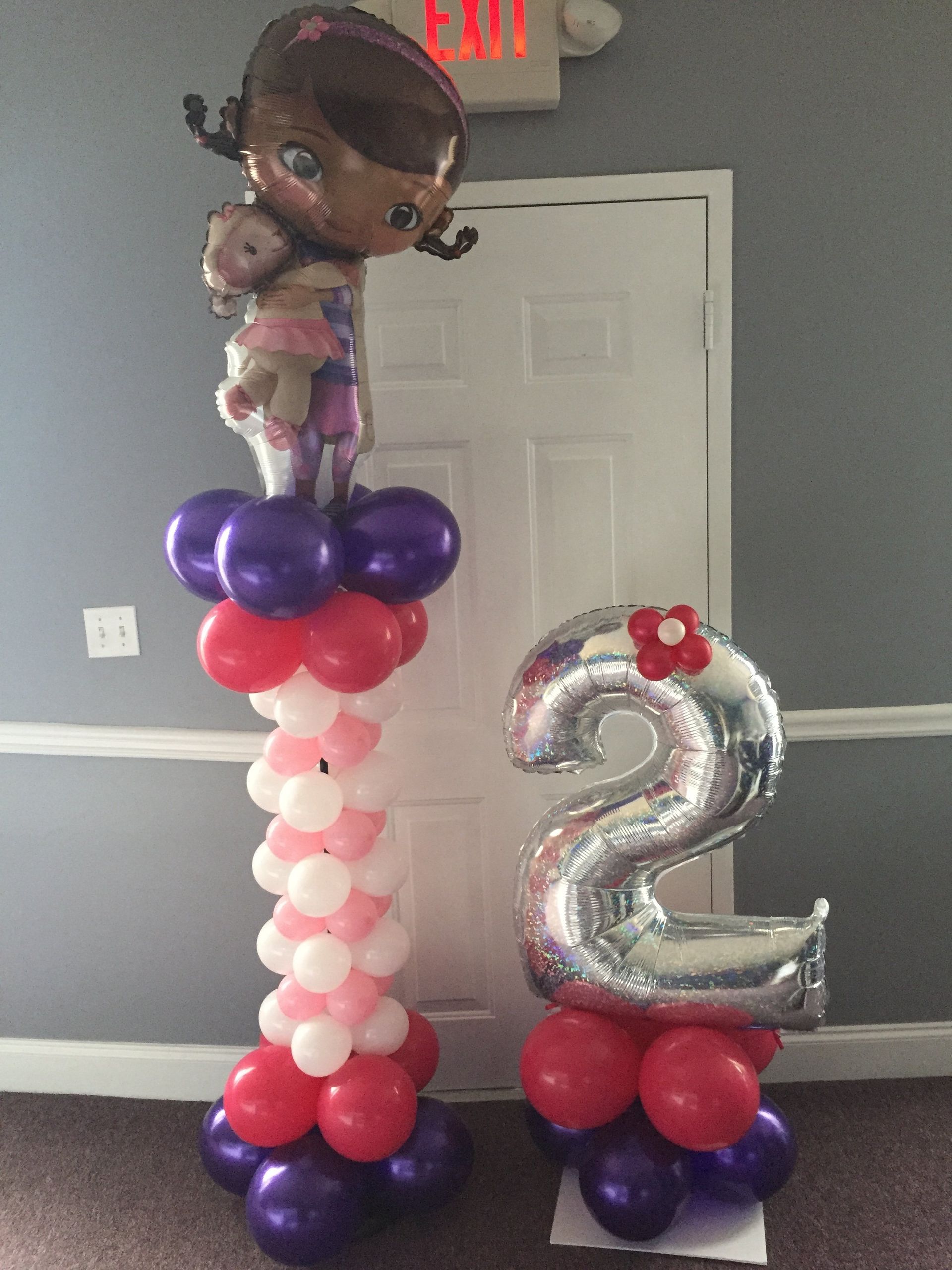 Two columns, both comprised of balloons. One is tall with Doc McStuffins at the top.