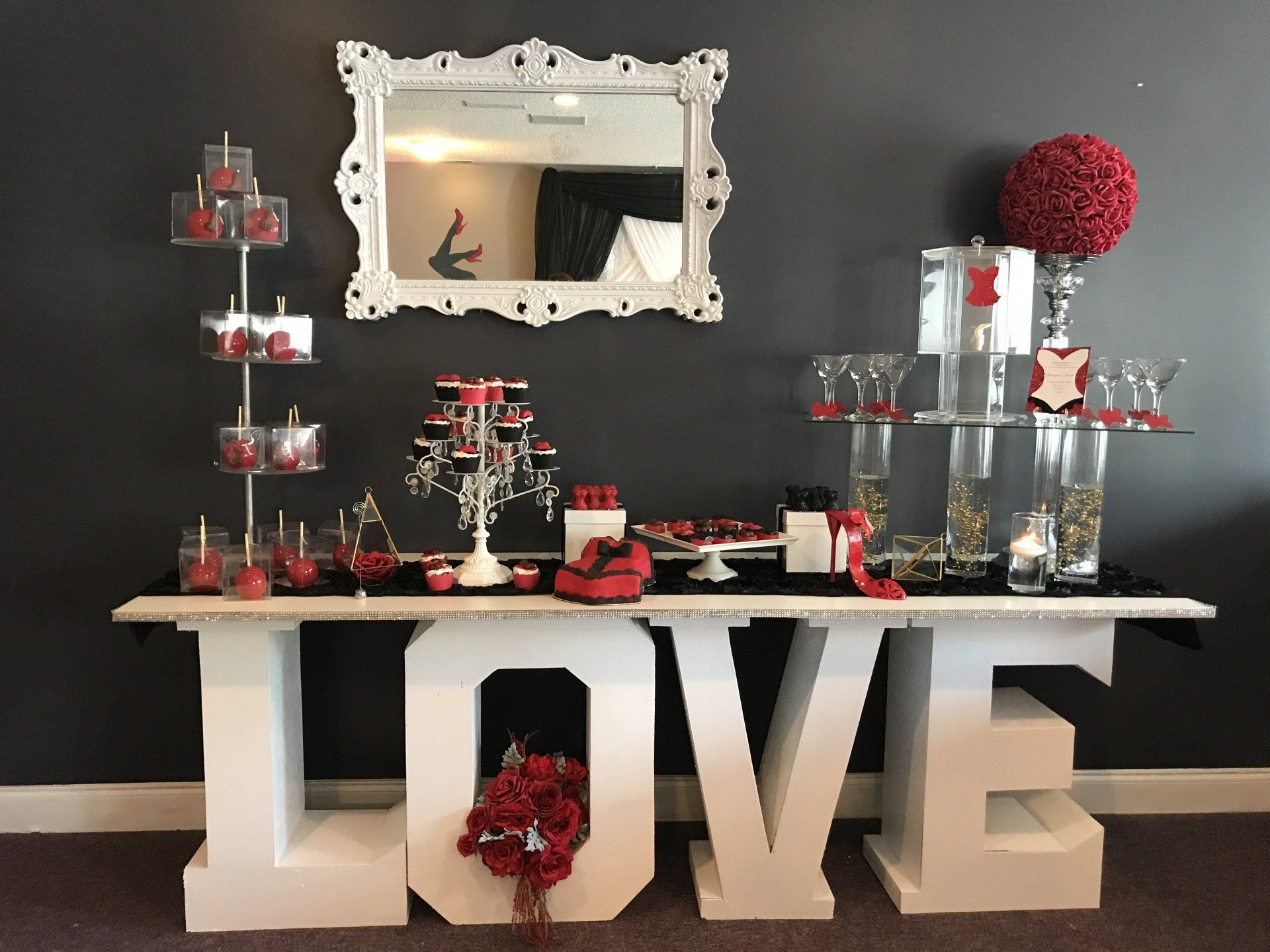 Dessert table with a red, black and white theme