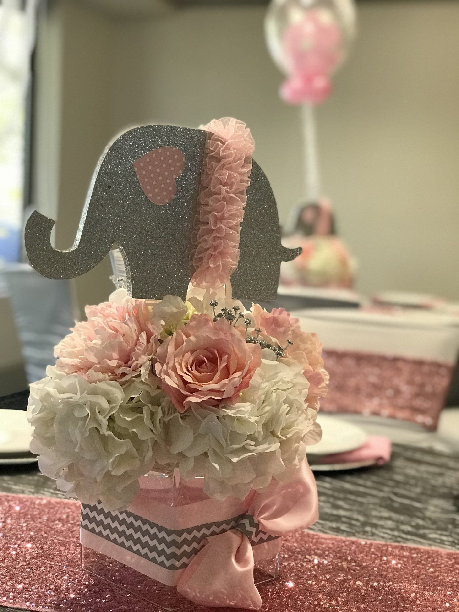Baby shower event design with a pink, white and grey theme. 