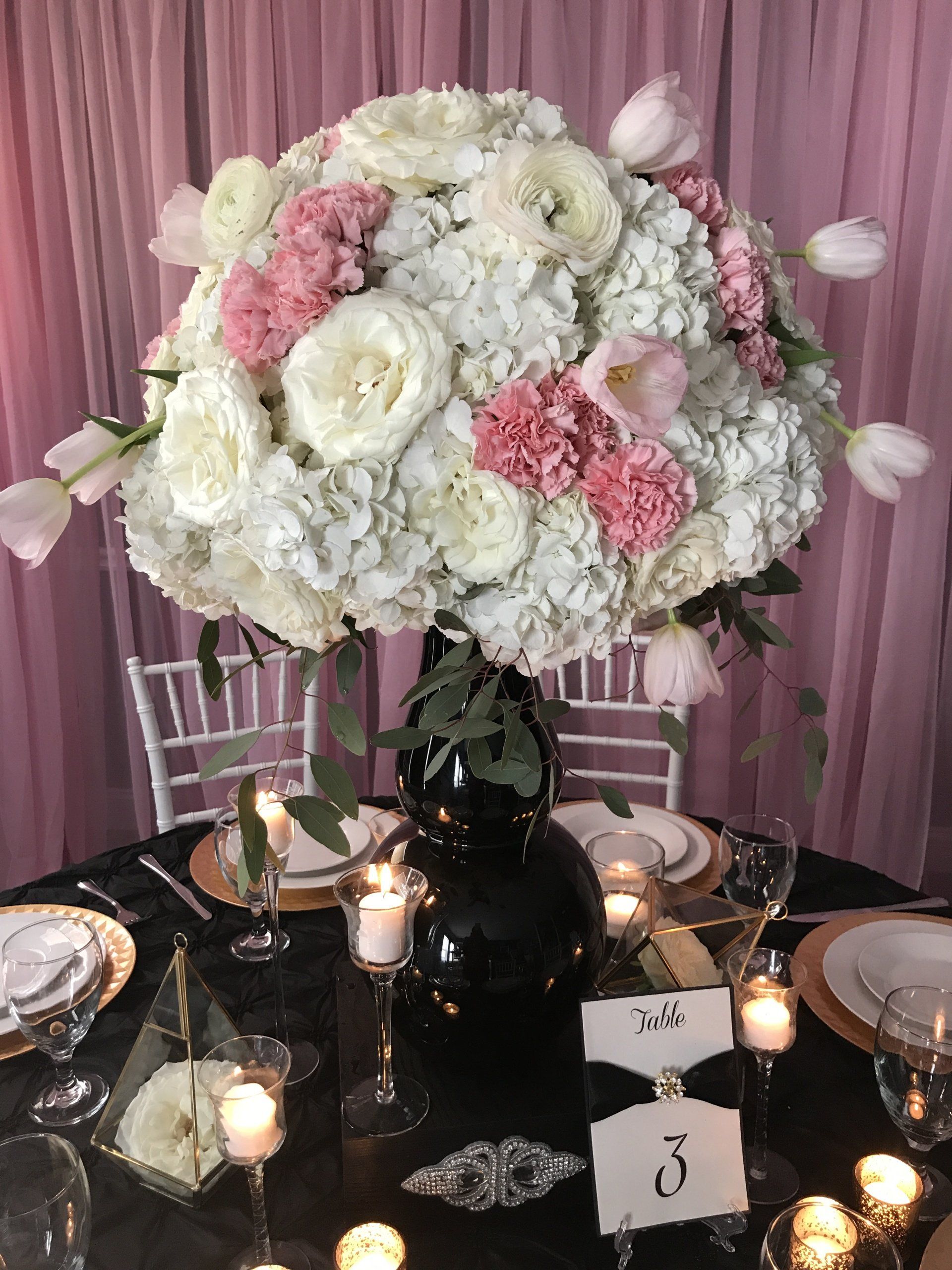 Custom centerpiece design with a tall floral arrangement 